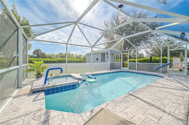 view of swimming pool featuring an in ground hot tub, glass enclosure, and a patio area