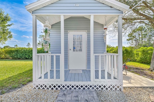 entrance to property featuring a yard