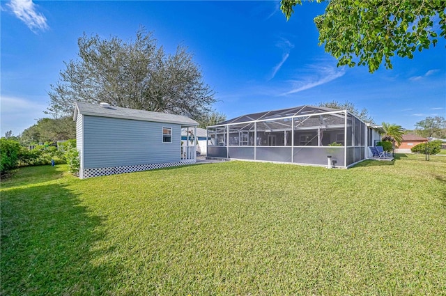 back of property featuring a lanai and a yard