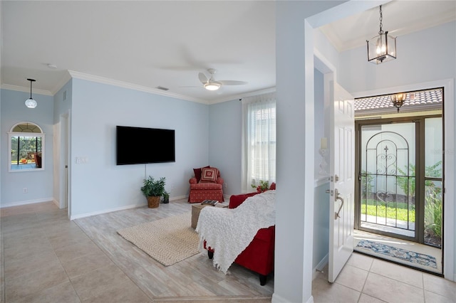 entryway with light tile patterned floors, crown molding, and ceiling fan with notable chandelier