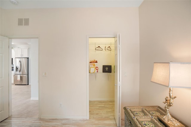 hallway featuring light hardwood / wood-style floors