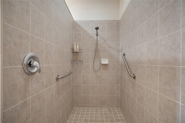 bathroom with tiled shower