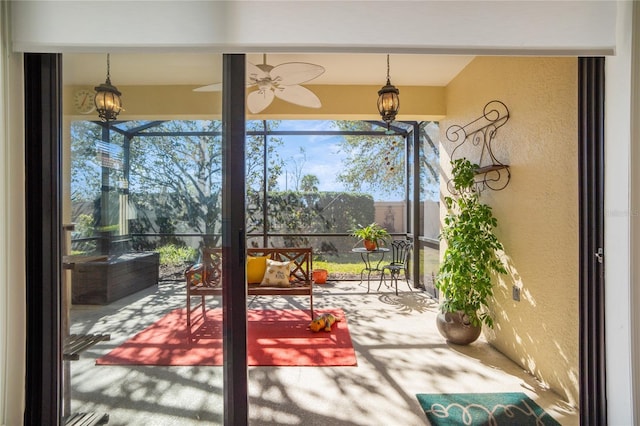 entryway with plenty of natural light and ceiling fan