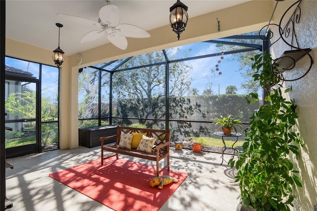 sunroom / solarium featuring ceiling fan