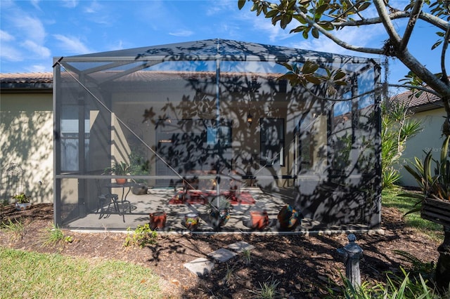 exterior space featuring a lanai and a patio area