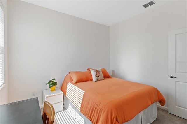 bedroom featuring light colored carpet