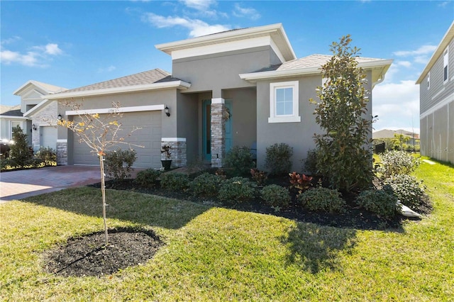 view of front of house with a garage and a front yard