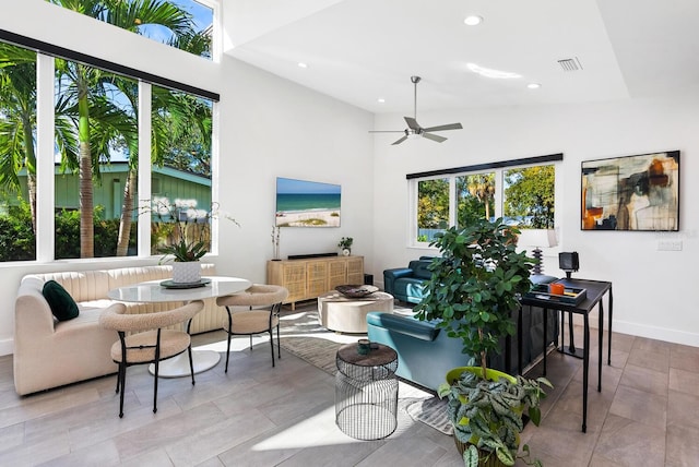 living room with plenty of natural light and a high ceiling