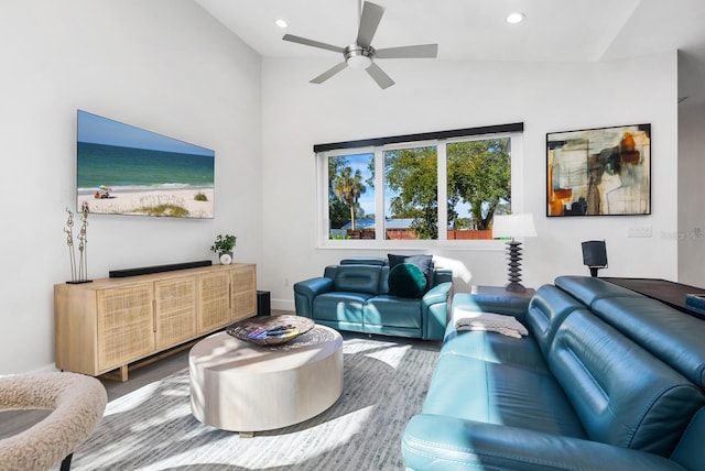 living room featuring vaulted ceiling and ceiling fan