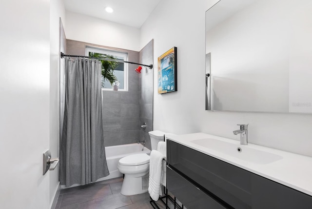 full bathroom with shower / tub combo, vanity, tile patterned flooring, and toilet