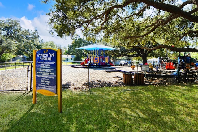 view of jungle gym featuring a lawn