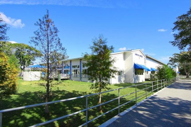 view of side of property featuring a yard