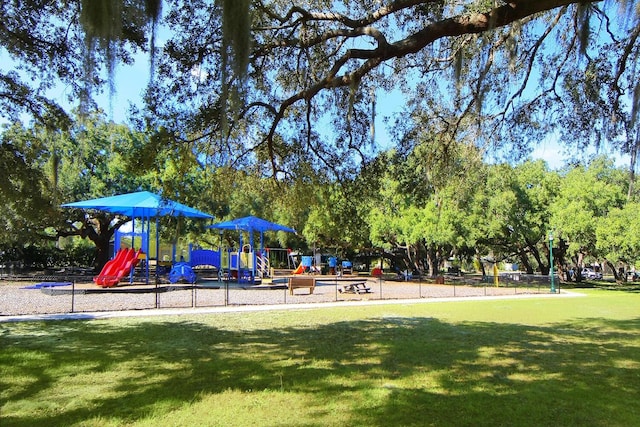 view of jungle gym with a lawn