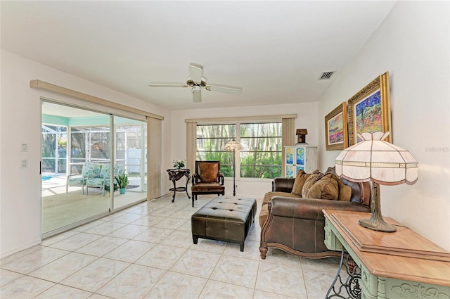 living room with light tile patterned flooring and ceiling fan