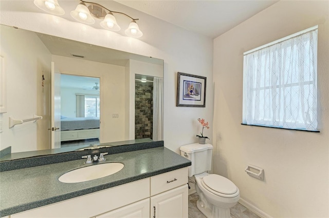 bathroom featuring vanity, a shower with curtain, a wealth of natural light, and toilet