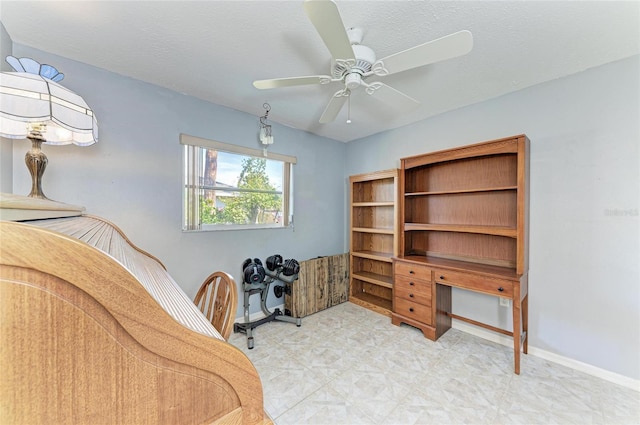 office area featuring a textured ceiling and ceiling fan