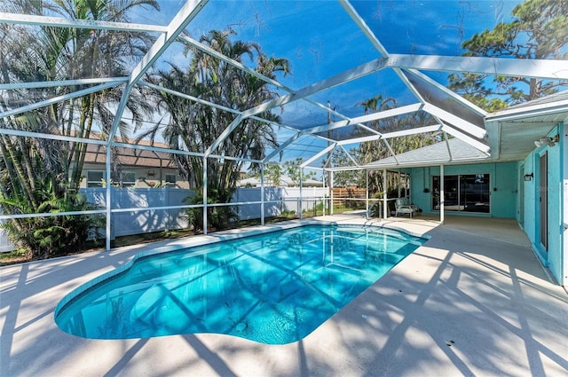 view of pool with a patio and a lanai