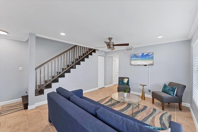 living room featuring crown molding, ceiling fan, and light tile patterned flooring