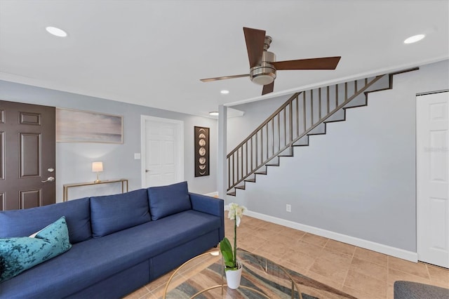 living room with tile patterned flooring and ceiling fan