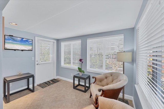 living area featuring light tile patterned floors