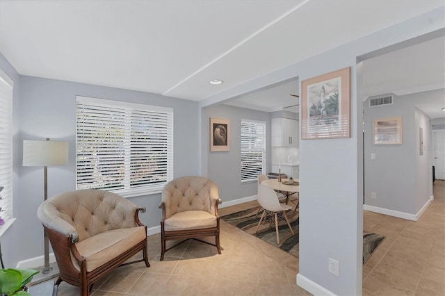 sitting room with light tile patterned floors