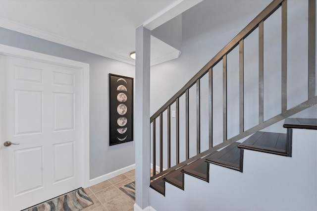 stairway featuring crown molding