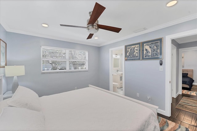 bedroom featuring ceiling fan, ornamental molding, wood-type flooring, and connected bathroom