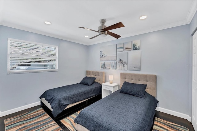 bedroom featuring wood-type flooring, ornamental molding, and ceiling fan