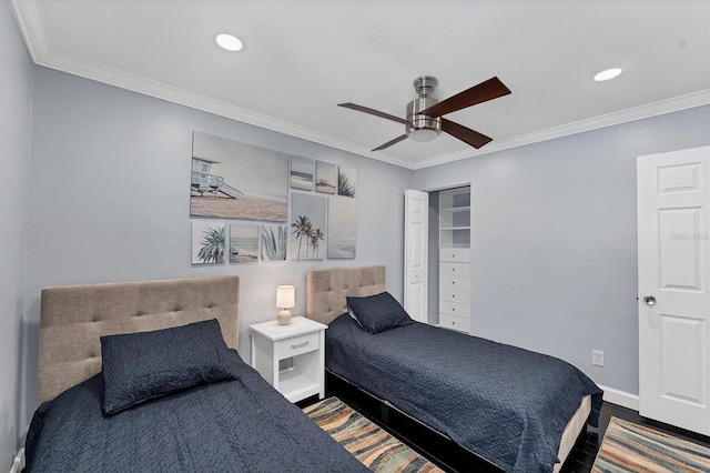 bedroom with ceiling fan, ornamental molding, and wood-type flooring