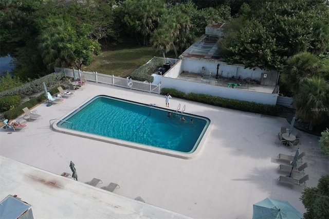 view of swimming pool featuring a patio area