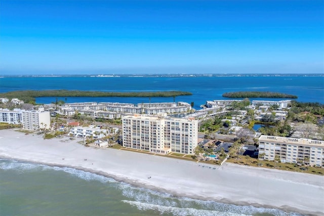 drone / aerial view with a water view and a view of the beach