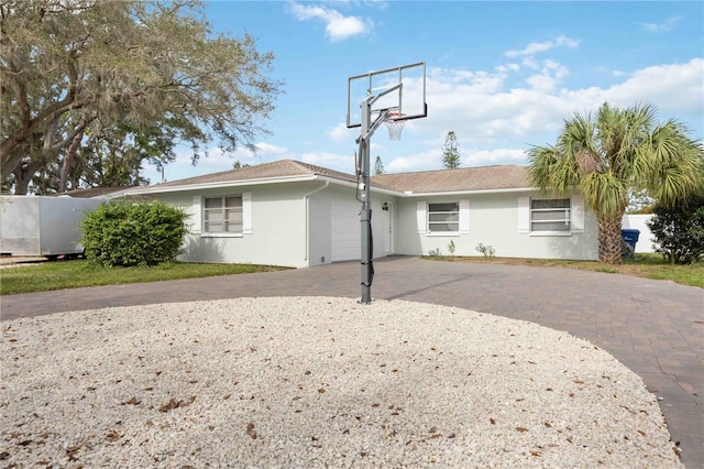 rear view of house featuring a garage