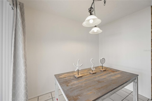 kitchen featuring decorative light fixtures and light tile patterned floors