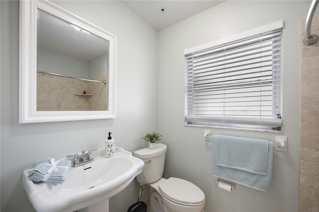 bathroom featuring sink and toilet