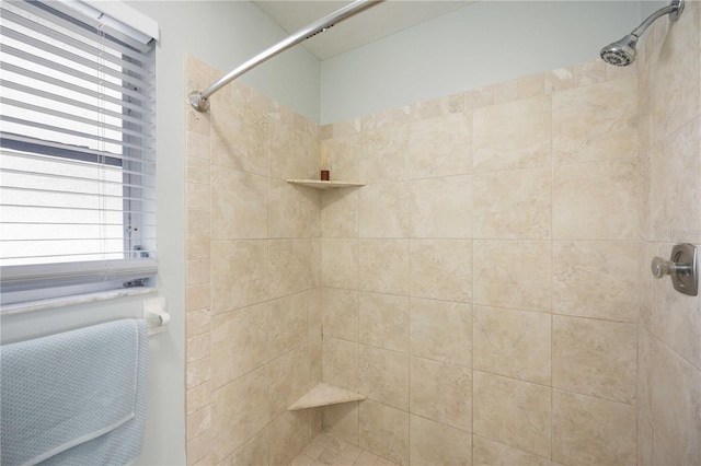 bathroom with tiled shower