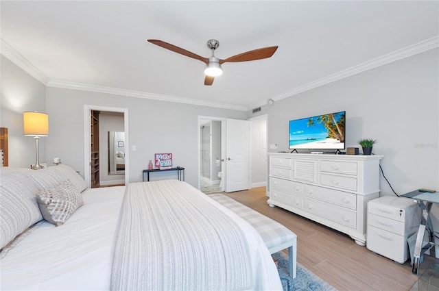 bedroom featuring connected bathroom, light wood-type flooring, crown molding, and ceiling fan