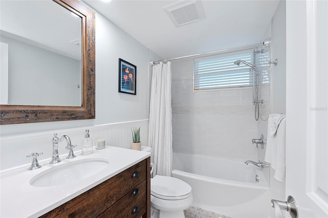 full bathroom with toilet, shower / bathtub combination with curtain, and vanity