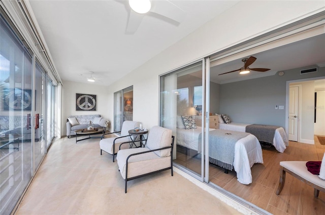 bedroom featuring ceiling fan and access to outside