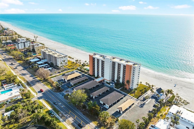 bird's eye view featuring a water view and a view of the beach