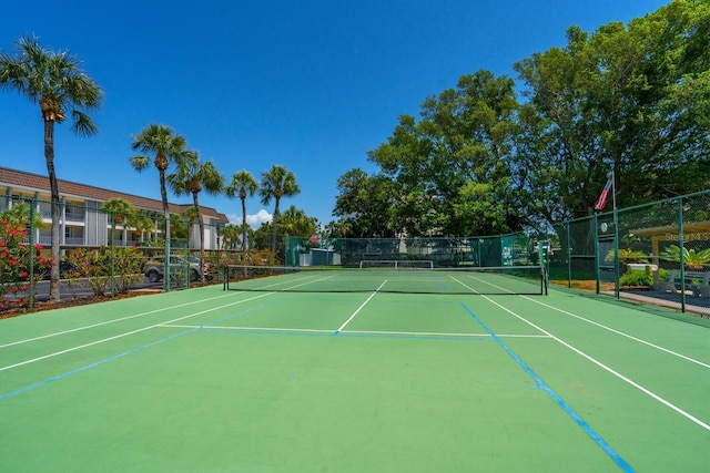 view of sport court with basketball hoop