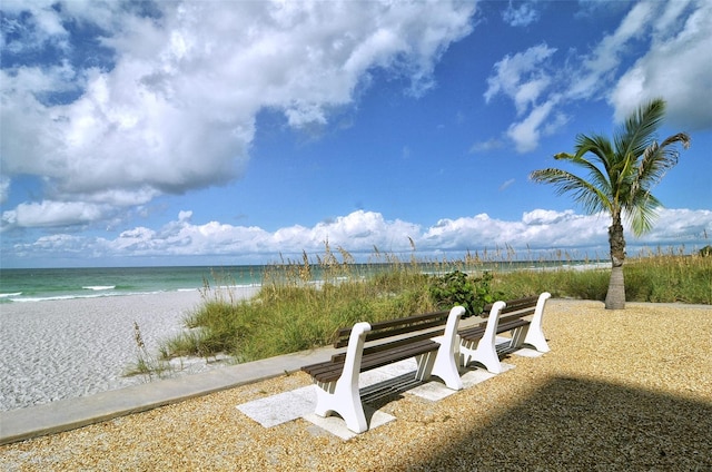 exterior space with a beach view and a water view