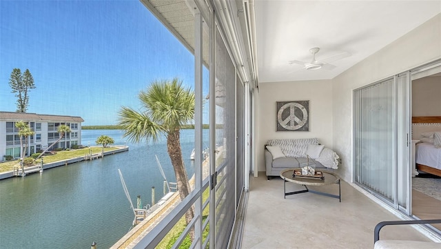 sunroom with a water view and a healthy amount of sunlight