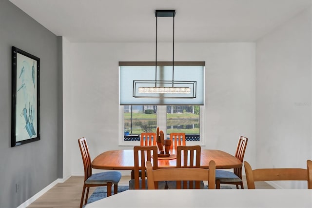 dining area with light wood-type flooring