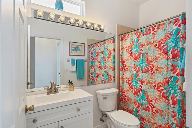 bathroom with vanity, a shower with curtain, and toilet