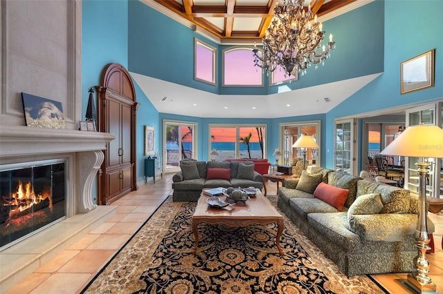 living room with crown molding, a notable chandelier, a high end fireplace, coffered ceiling, and beamed ceiling