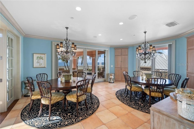 dining area with visible vents, crown molding, french doors, a healthy amount of sunlight, and a chandelier