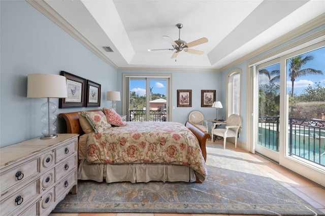 bedroom with a tray ceiling, visible vents, ornamental molding, a ceiling fan, and access to outside