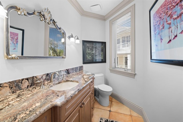 bathroom with plenty of natural light, vanity, toilet, and crown molding