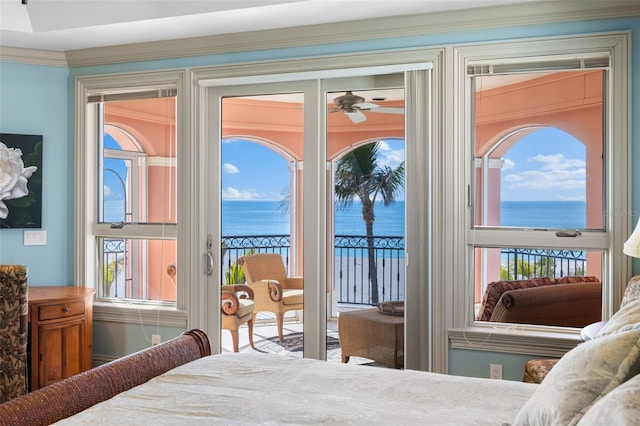 bedroom with access to exterior, a water view, and crown molding