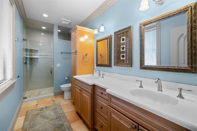 bathroom with a sink, a shower stall, toilet, and double vanity